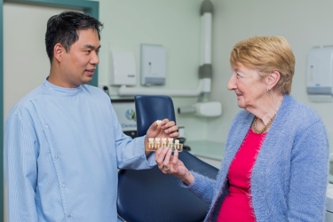 Dr. Van with a patient during a Crowns procedure